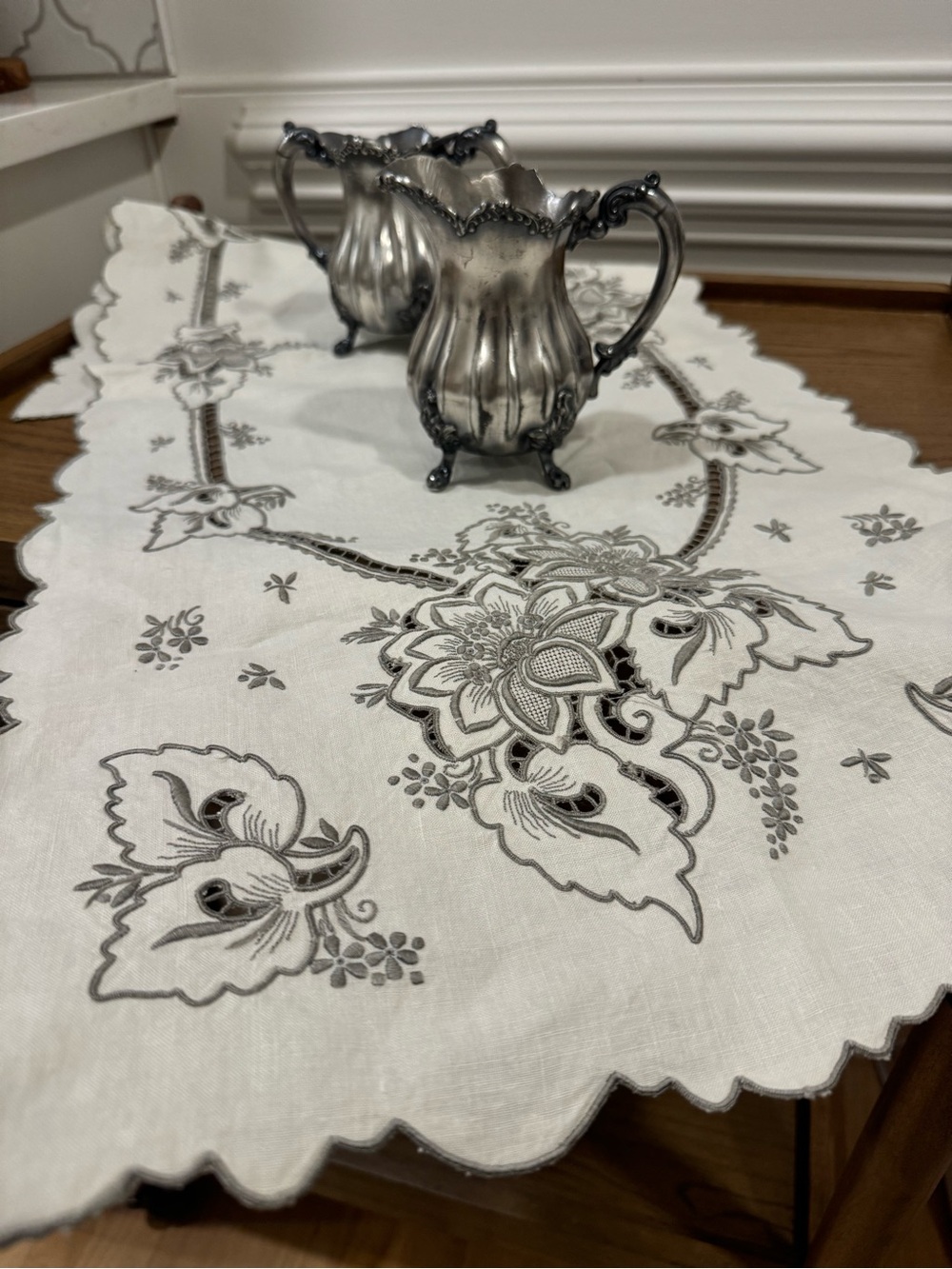 Elegant White Embroidered Linen Table Runner with Gray Floral Motif